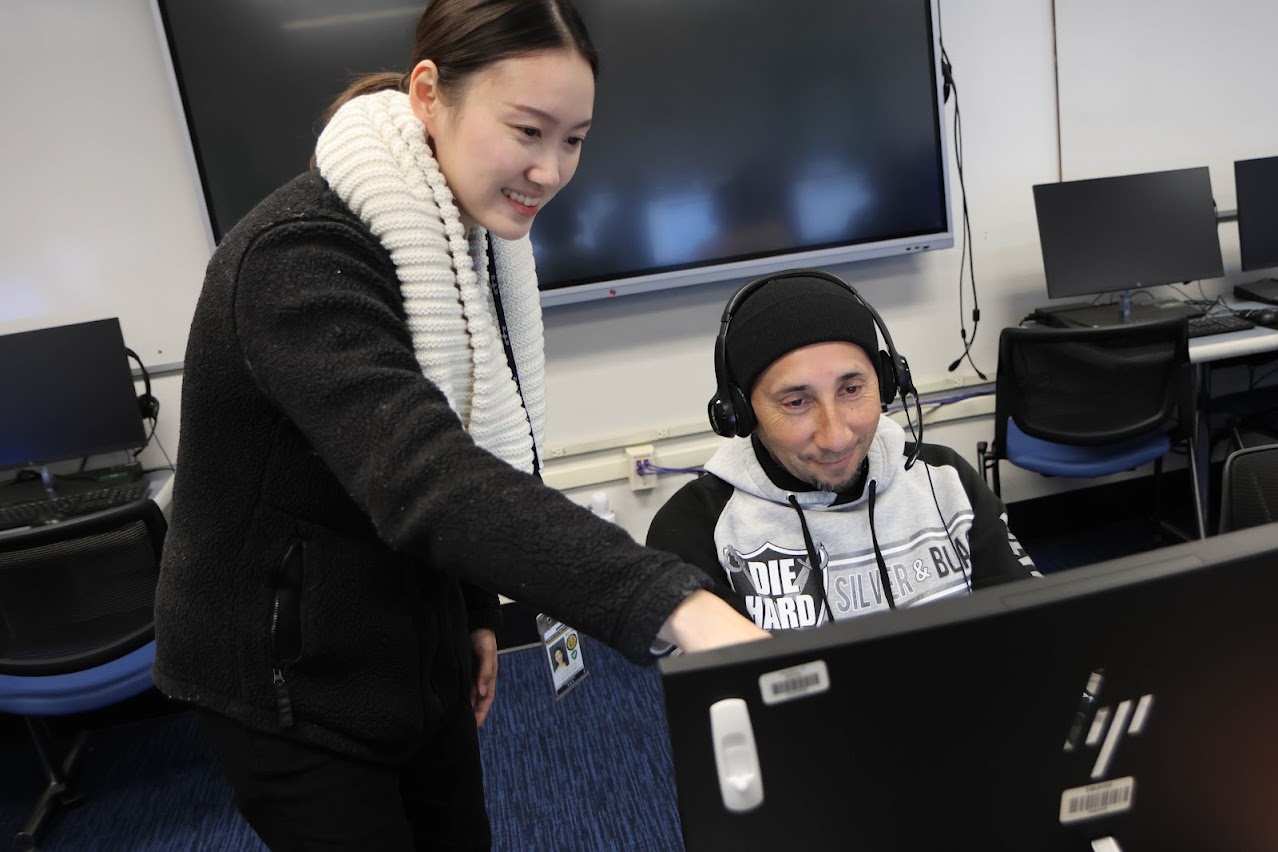 Students looking at the computer